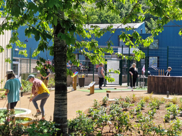 Players moving through the finished adventure golf course