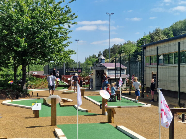 Adventure golf hole with integrated scenic work