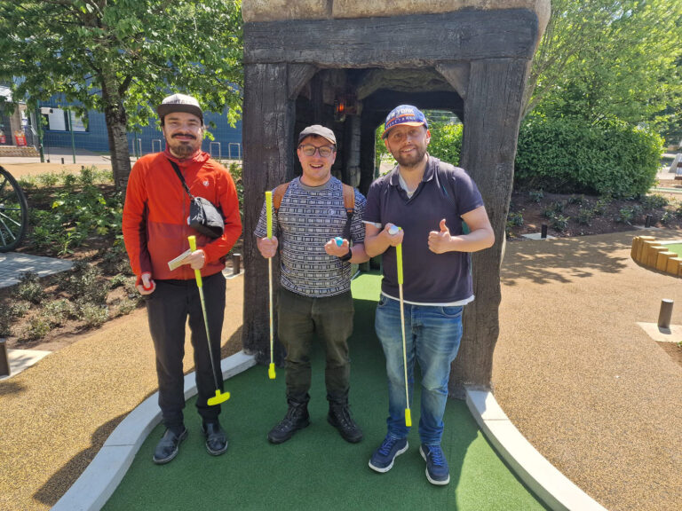 Players enjoying Dynamite Adventure Golf